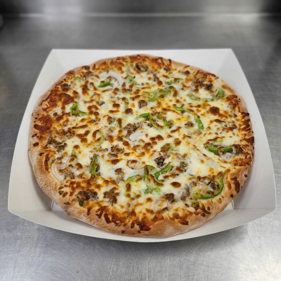A Clarksville Crust pizza with melted cheese, sausage, green peppers, and onions in a white box.